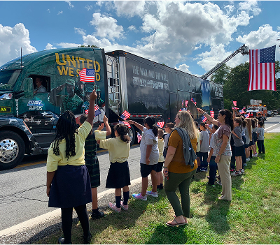 Children greeting TWTH truck & trailer The Wall That Heals Athens Children greeting TWTH truck & trailer