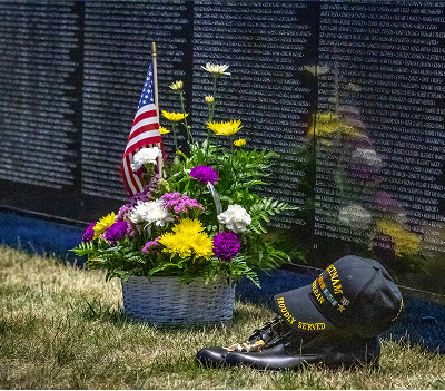 The Wall That Heals Athens Wall touching Flowers, boots & cap